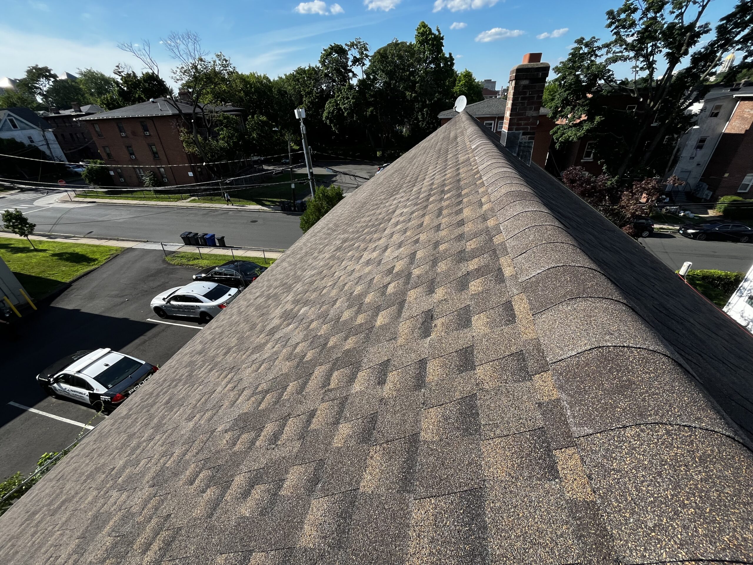 Close-up of a clean, freshly installed asphalt shingle roof